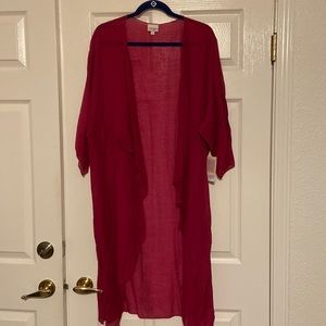 Lightweight and gauzy feel.  Solid fuchsia Shirley kimono from Lularoe. L  & NWT